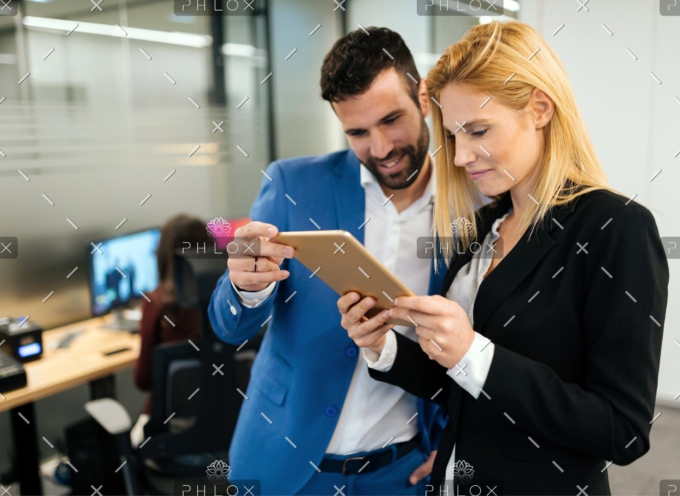 demo-attachment-143-businesspeople-discussing-while-using-digital-WFGVC3X