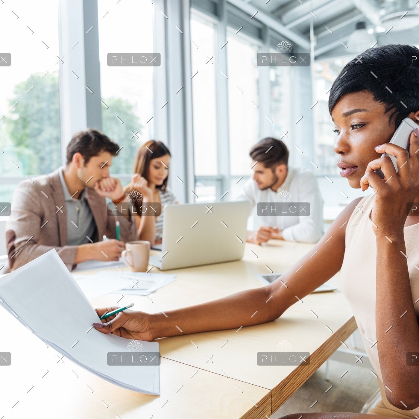 demo-attachment-129-serious-businesswoman-with-documents-talking-on-P9Q6LX6